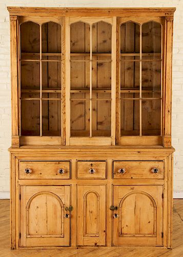 A 19TH CENTURY PINE CABINET IN TWO PARTS