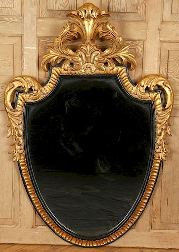 CARVED GILT WOOD SHIELD SHAPED MIRROR BY DAUPHINE