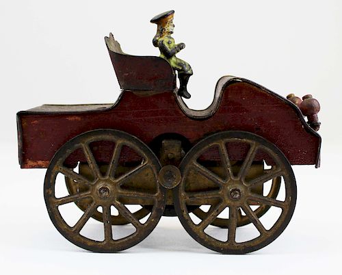 early automobile friction toy with cast iron rider