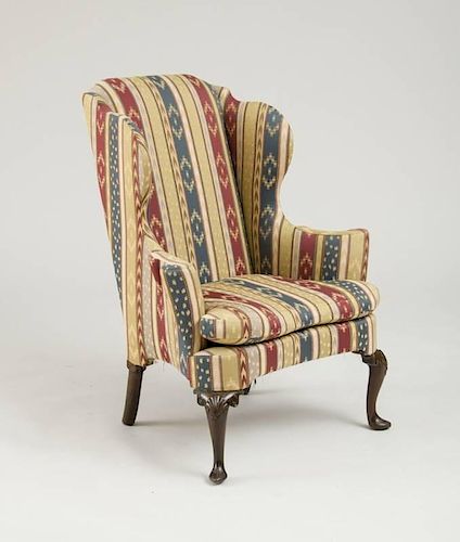 GEORGE I CARVED WALNUT WING ARMCHAIR