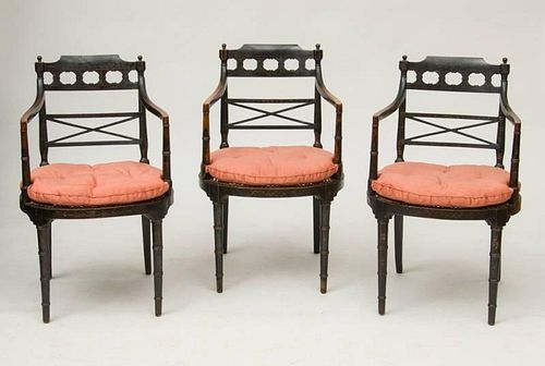 SET OF THREE REGENCY BLACK-PAINTED AND CANED ARMCHAIRS