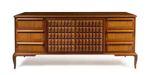Italian, c. 1950, a sideboard with carved wood doors