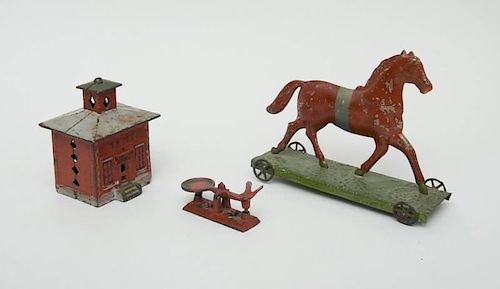 AMERICAN RED-PAINTED CAST-IRON STILL BANK, TWO-PIECE CAST-IRON MODEL OF A STORE SCALE AND A PAINTED TIN TROTTING HORSE PULL TOY