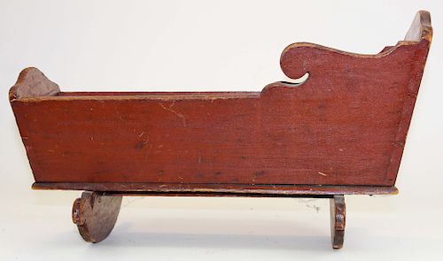 early 19th c wooden doll cradle in red paint