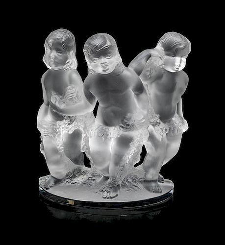 A Lalique Molded and Frosted Glass Figural Group Height 7 1/2 inches.