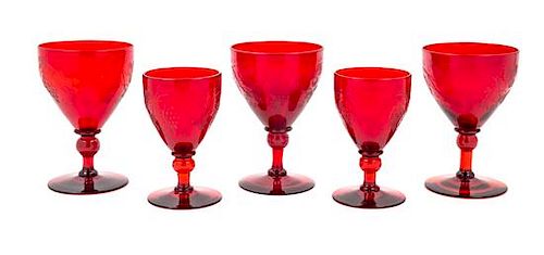 Five Steuben Selenium Red Glasses in the Grape Pattern Height of tallest 5 1/8 inches.
