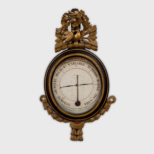 A French Empire Parcel-Gilt and Ebonized Wood Barometer