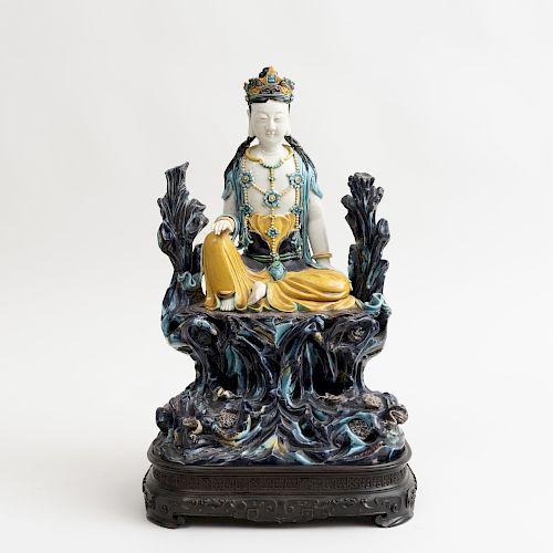Chinese Aubergine, Turquoise, Yellow and Green Glazed Porcelain Figure of Seated Guanyin