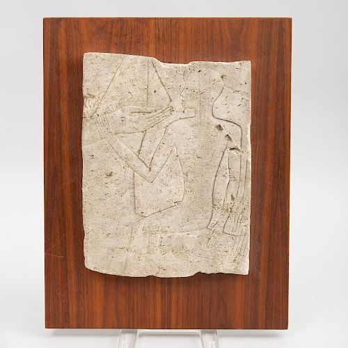 Egyptian Limestone Relief Fragment: A Young King Being Suckled by the Goddess Isis