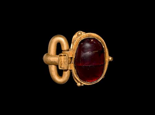Migration Period Gold Buckle with Large Cabochon Garnet