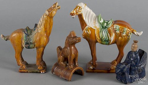Two Chinese pottery horses, 20th c., together with a roof tile and a blue glaze figure