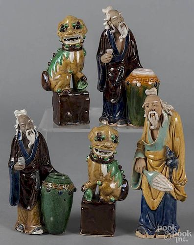 Three Chinese pottery mud men figures, tallest - 9'', together with a pair of pottery foo dogs