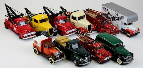 ten diecast trucks, tow trucks, fire trucks