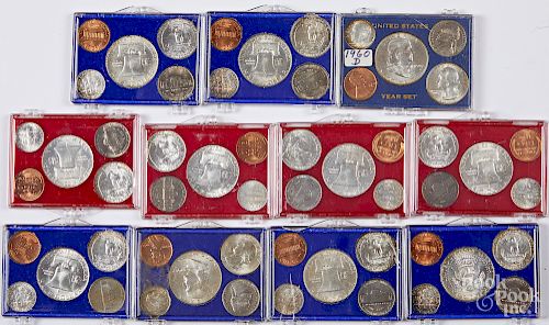 Eleven pre-1964 US coin year sets.