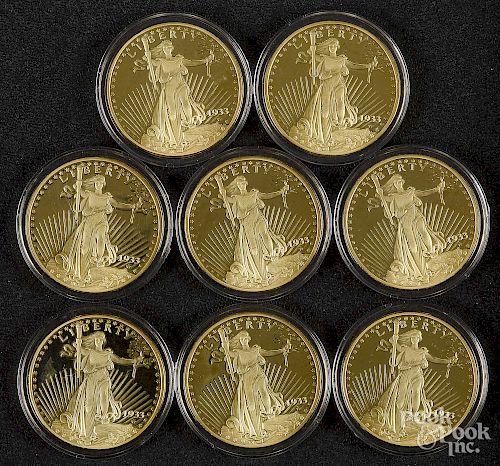 Eight replica 1933 gold double eagle proof coins.