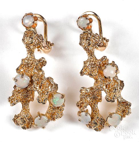 Pair of 14K yellow gold and opal earrings.