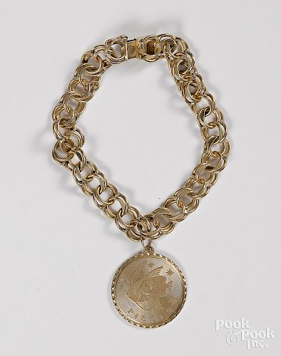 14K yellow gold bracelet, with Pisces pendant.
