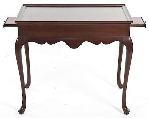 A Queen Anne Style Mahogany Center Table, Height 26 x width 30 1/2 x depth 19 inches.