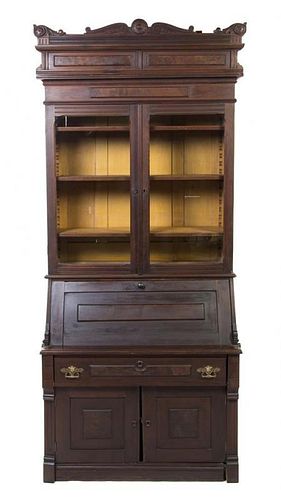 An American Walnut Secretary Bookcase, Height 93 x width 37 x depth 21 1/2 inches.