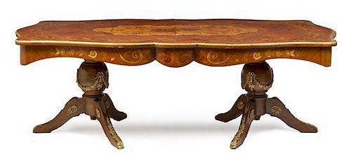 A Louis XV Style Gilt Metal Mounted Marquetry Extension Dining Table, Height 30 x width 93 x depth 46 inches.