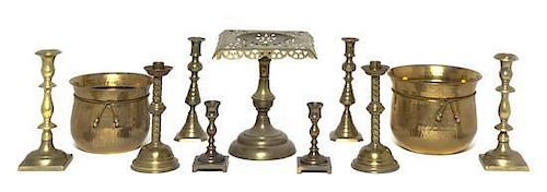 Four Pairs of Brass Candlesticks, Height of tallest 8 7/8 inches.