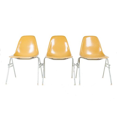 Three Eames molded fiberglass chairs