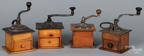 Four coffee grinders, with cast iron tops