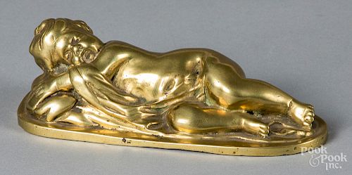 Cast brass paperweight of a sleeping child