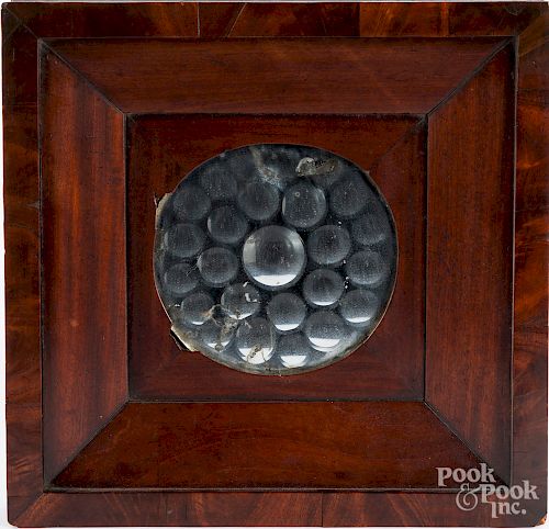Bullseye mirror, 19th c., in a mahogany frame