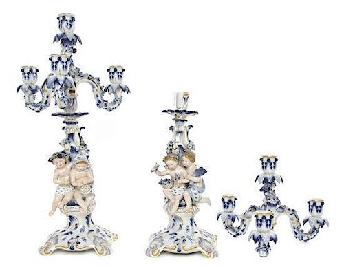 A Pair of Meissen Porcelain Figural Four-Light Candelabra, Height 19 1/2 inches.