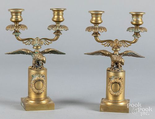 Pair of brass eagle candelabra