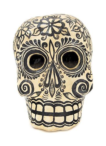 A Mexican Papier Mache Dia de los Muertos Skull Height 9 1/4 inches.