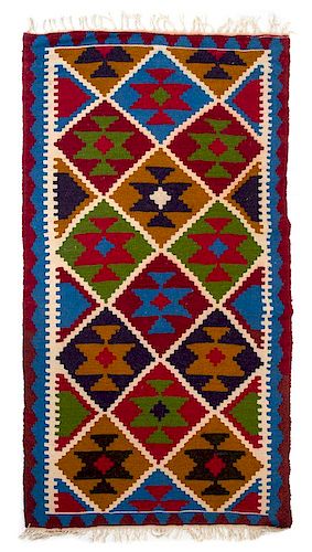Two Mexican Wool Rugs First: 5 feet 5 inches x 3 feet.
