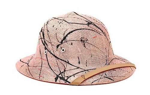 A Splatter Painted Pith Helmet Width 13 1/2 inches.