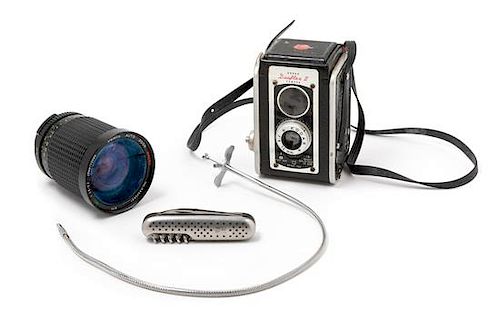 A Kodak Duaflex II Camera and a Starblitz Lens Height of camera 5 inches.