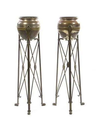 A Pair of Art Nouveau Style Patinated Metal Jardiniere Stands, Height 45 1/2 inches.
