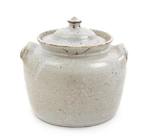 A Glazed Ceramic Jar and Cover Height 7 inches.
