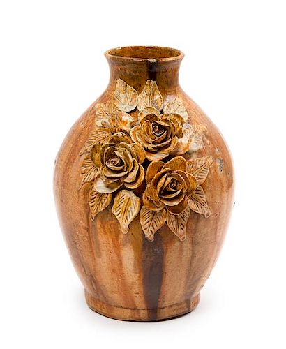 A Glazed Pottery Vase with Applied Flowers Height 10 7/8 inches.