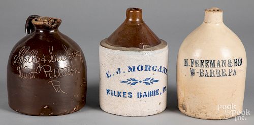 Three stoneware merchant jugs