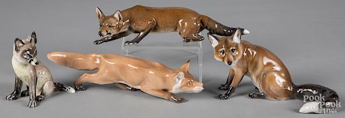 Four Rosenthal porcelain fox figures.