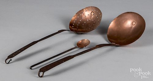 Three wrought iron and copper utensils.