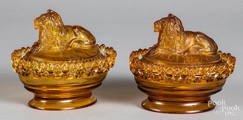 Pair of glass lion candy dishes