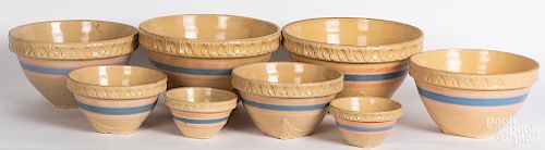Eight yelloware mixing bowls