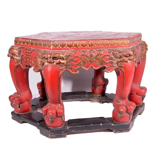 A 19th century red lacquered Chinese table.
