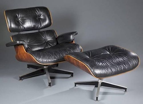 Eames rosewood lounge chair with ottoman.
