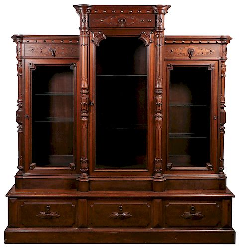 A VICTORIAN WALNUT THREE-SECTIONED BOOKCASE