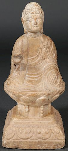 A CHINESE CARVED LIMESTONE BUDDHA, POSSIBLY MING