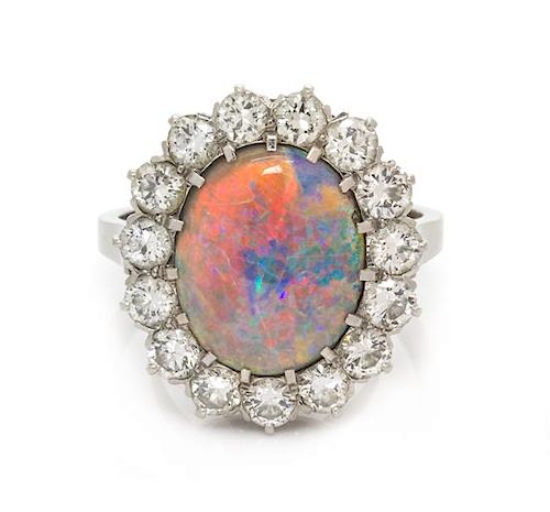 A Platinum, Opal and Diamond Ring, 5.85 dwts.
