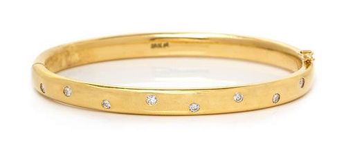 An 18 Karat Yellow Gold and Diamond Bangle Bracelet, 27.70 dwts.