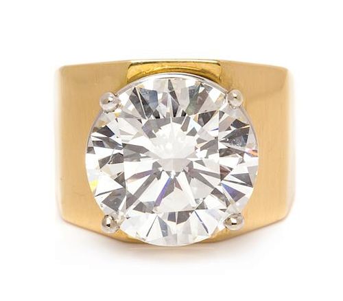 * An 18 Karat Yellow Gold and Diamond Solitaire Ring,